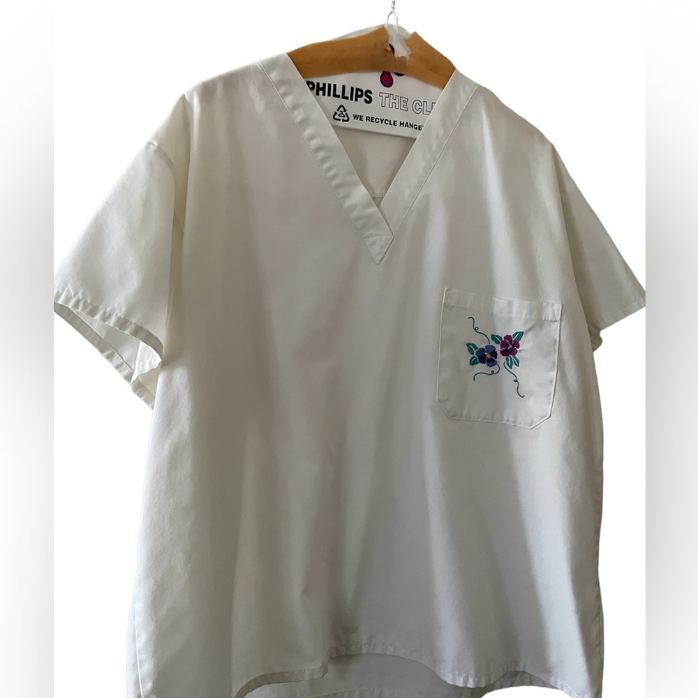 White cute scrub top with pansy on the pocket